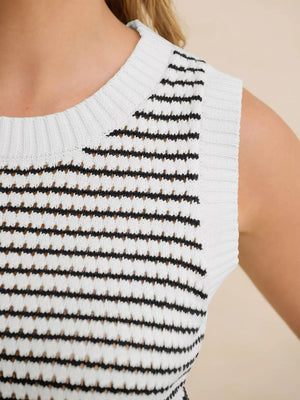 White knit sweater vest with black stripes and open knit texture.