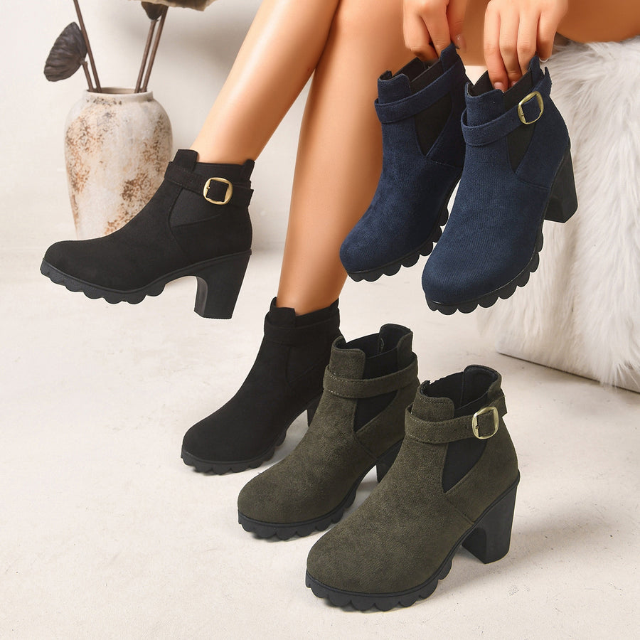 boots in black featuring block heel and structured fit