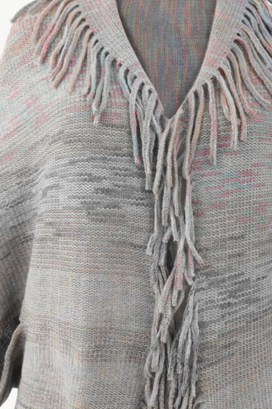 Textured stripe fringe cape in gray with subtle pink and blue threads, acrylic knit.