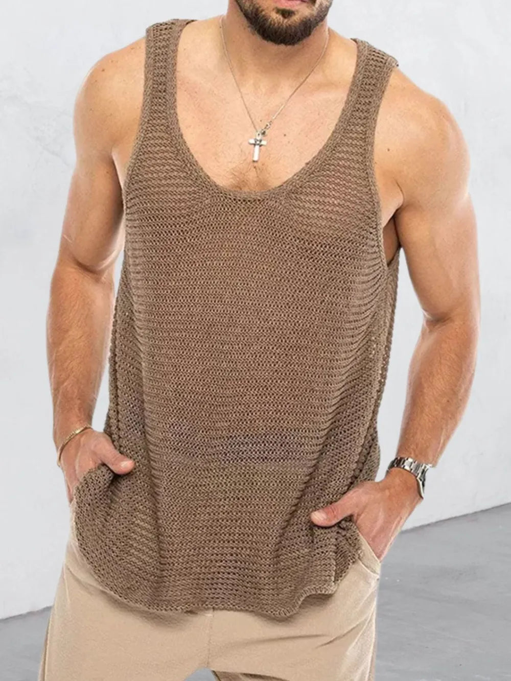 Open-knit scoop neck tank top in taupe acrylic with deep neckline.
