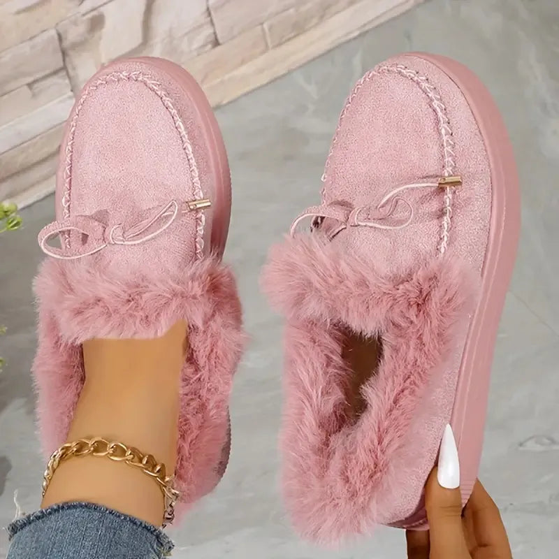 Pale blush suede loafers with shearling trim and bow detail