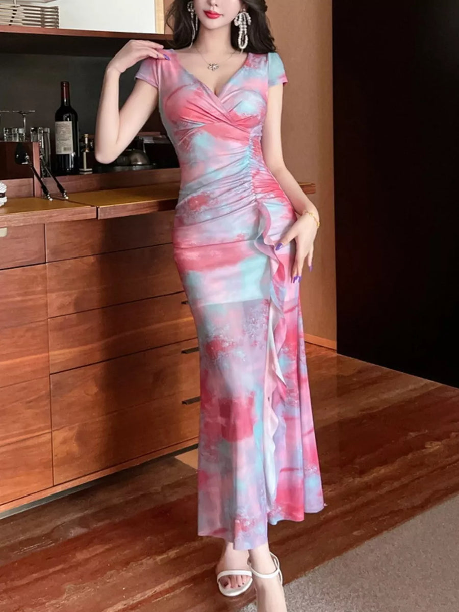 Surplice ruffle maxi dress in pink and blue tie-dye with ruched side detail.