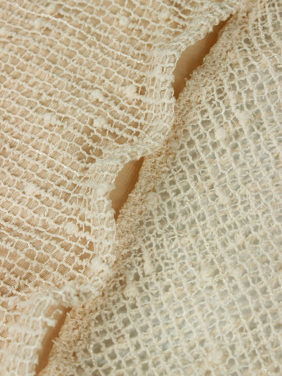 Openwork halter neck cover-up dress in cream textured knit with cutout details.
