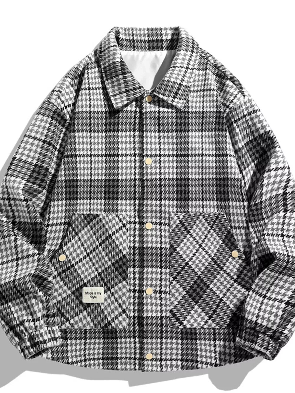 Men's black and white houndstooth button-up sport jacket with two chest pockets.