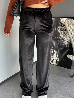 Black velvet tied wide-leg trousers with a comfortable fit.
