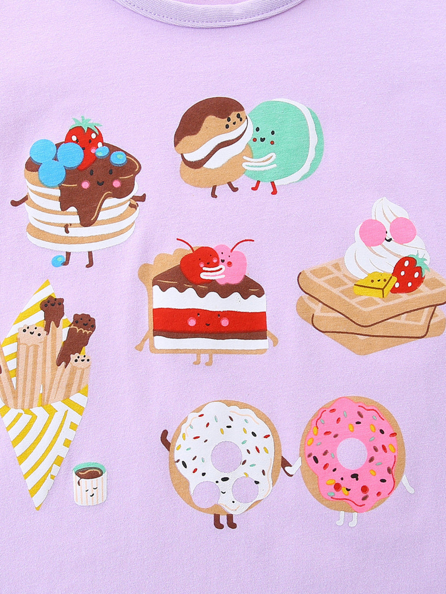 Lavender cotton t-shirt with a fun dessert print featuring pancakes, macarons, cake, waffles, donuts, and french fries.