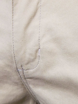 Khaki chino shorts detail showing stitching and pocket construction