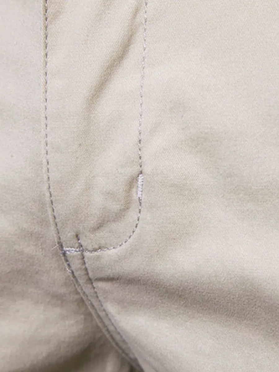 Khaki chino shorts detail showing stitching and pocket construction
