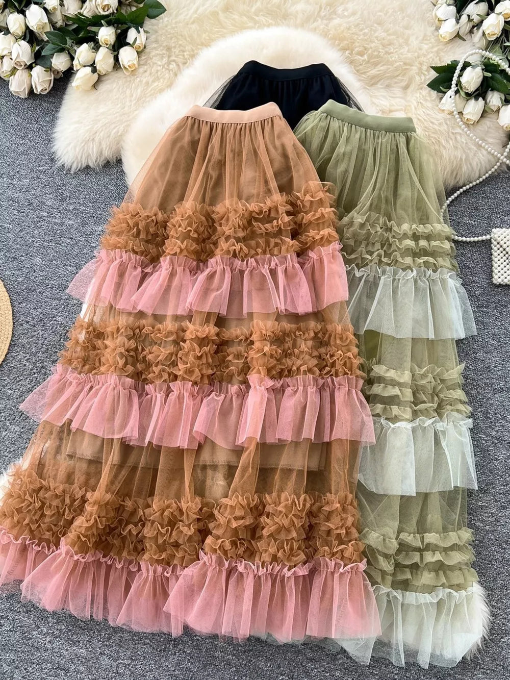 Tiered ruffle tulle maxi skirt in brown, green, and black with a flowy, layered design.