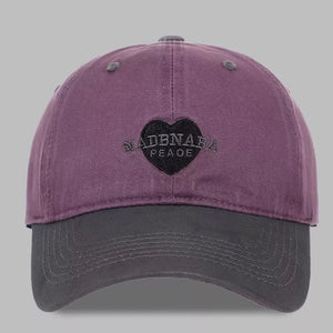 Vintage-washed baseball cap in purple and grey with heart embroidery and text detail