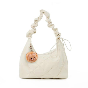Ivory ruched shoulder bag with a cute bear charm and quilted detail.