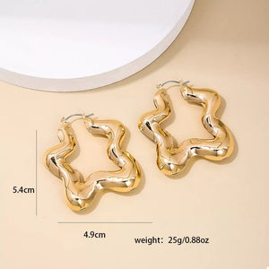 gold earrings with medium and hinged hoop