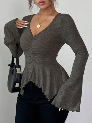 peplum top in charcoal featuring ruched and fitted fit
