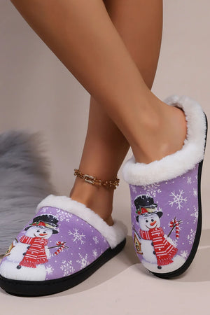 Purple snowman print faux fur lined slippers with white snowflakes.