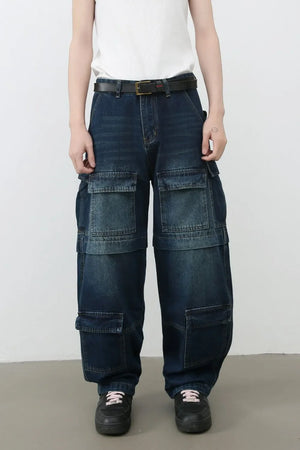 Dark denim cargo pants with layered pockets and a relaxed fit.