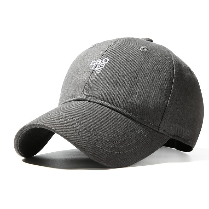 Grey baseball cap with curved brim and embroidered logo detail.