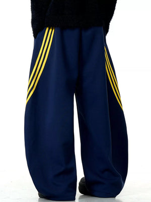 Men's navy blue wide-leg sweatpants with yellow side stripes