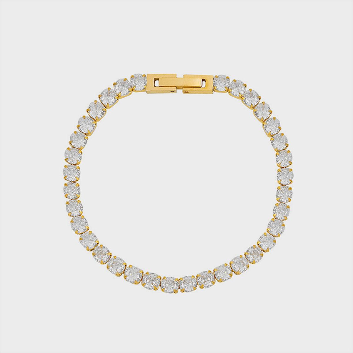 Gold pavé tennis bracelet with clear cubic zirconia stones and a gold clasp.