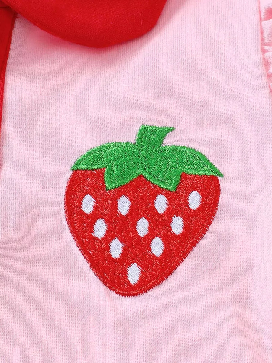 Pink cotton baby polo with strawberry embroidery and red collar detail.
