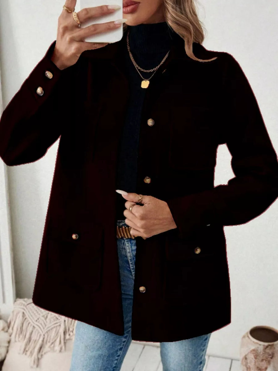 Chic button-front trench coat in black with pocket details and gold buttons.