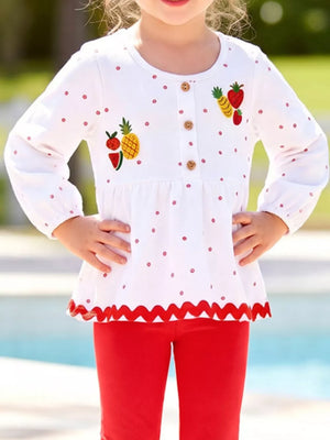 red peplum top featuring embroidered and polka dot