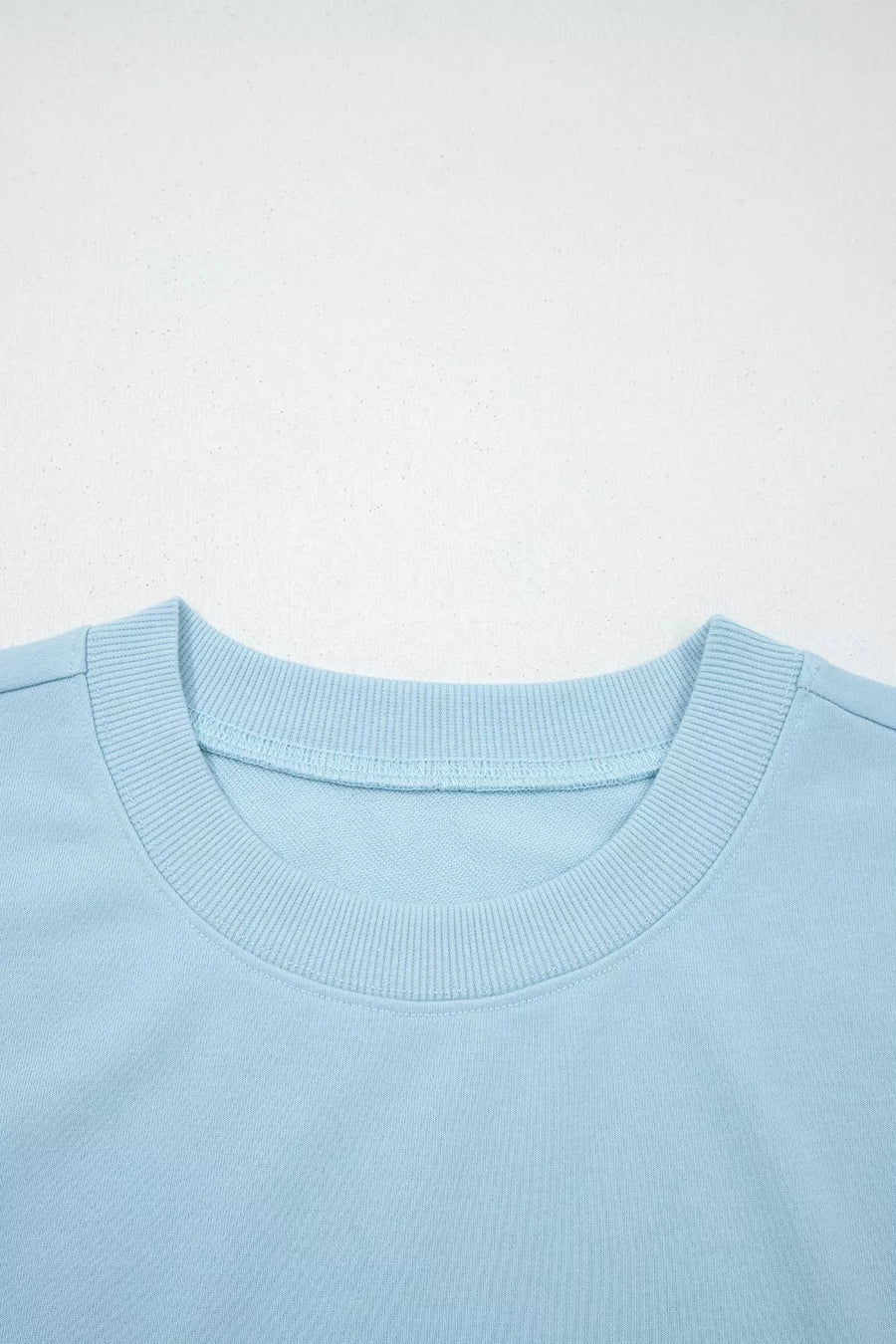 Light blue cotton crew neck sweatshirt with ribbed collar detail
