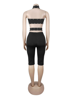 romper in black with cutout and bermuda