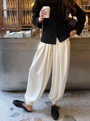 100% polyester Care instructions: Machine wash cold wide-leg pants in Cream with loose silhouette