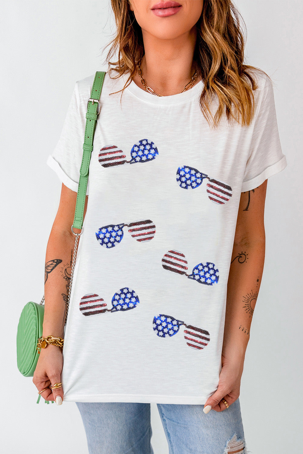 White t-shirt with all-over sequin American flag sunglasses graphic, short sleeves, crew neck.