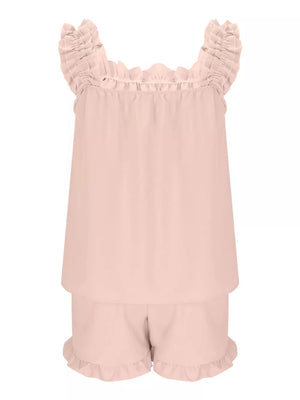 Pale blush ruffled pajama set with square neckline and ruffled shorts.