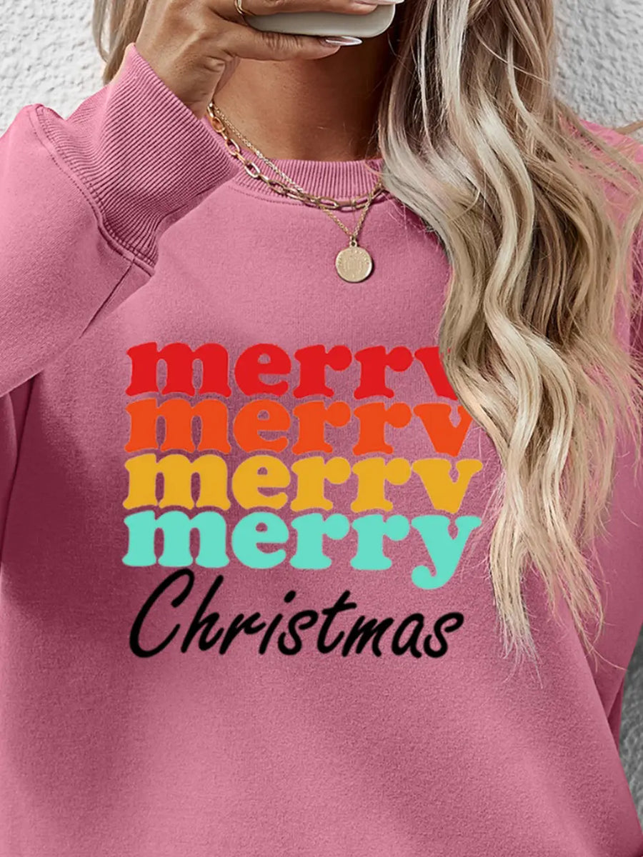 Blush Pink sweatshirt with retro "Merry Christmas" graphic in red, orange, yellow, and teal lettering.