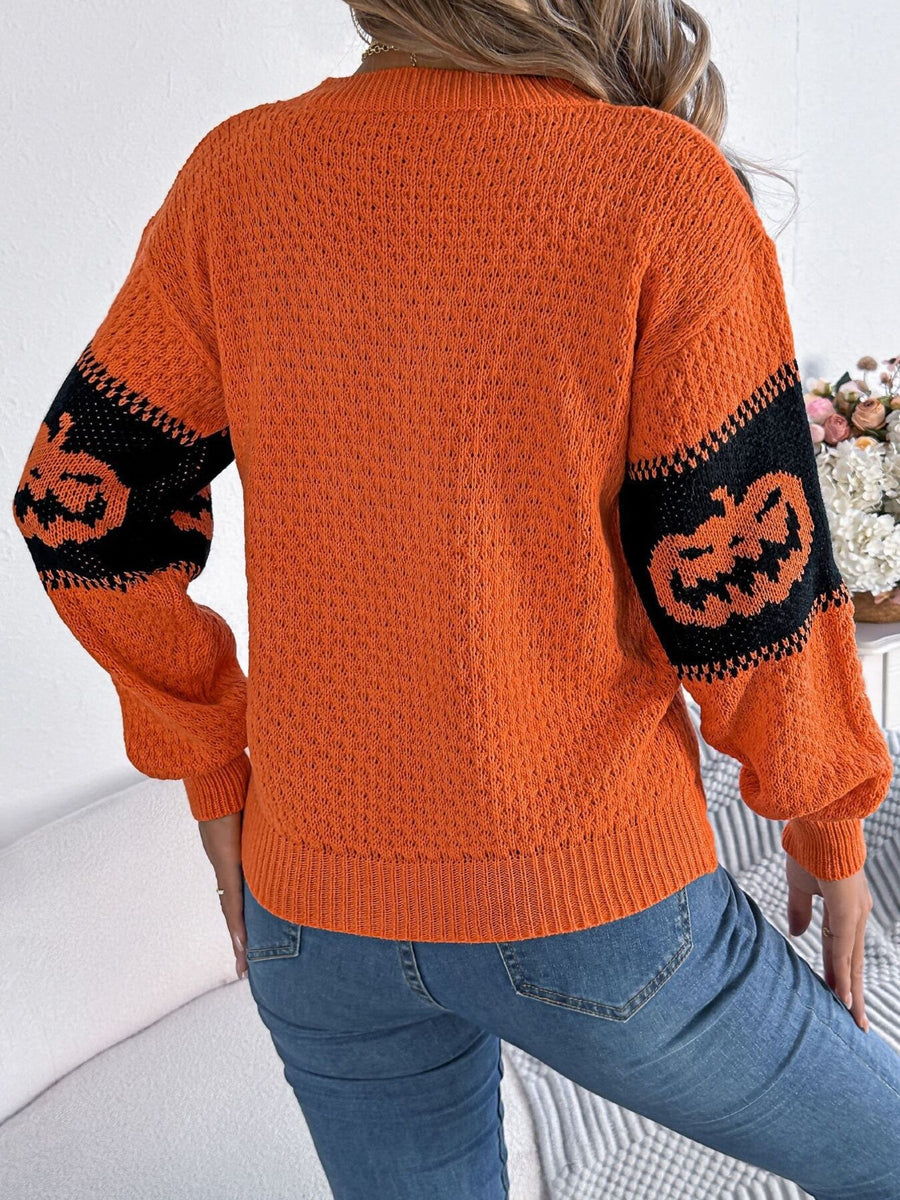 black pullover sweater featuring stretchy and pumpkin
