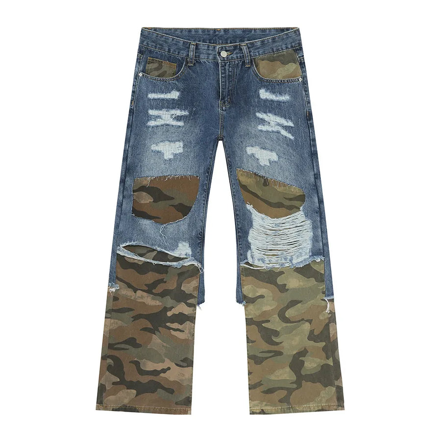 Distressed wide-leg jeans with camouflage panels and rips.