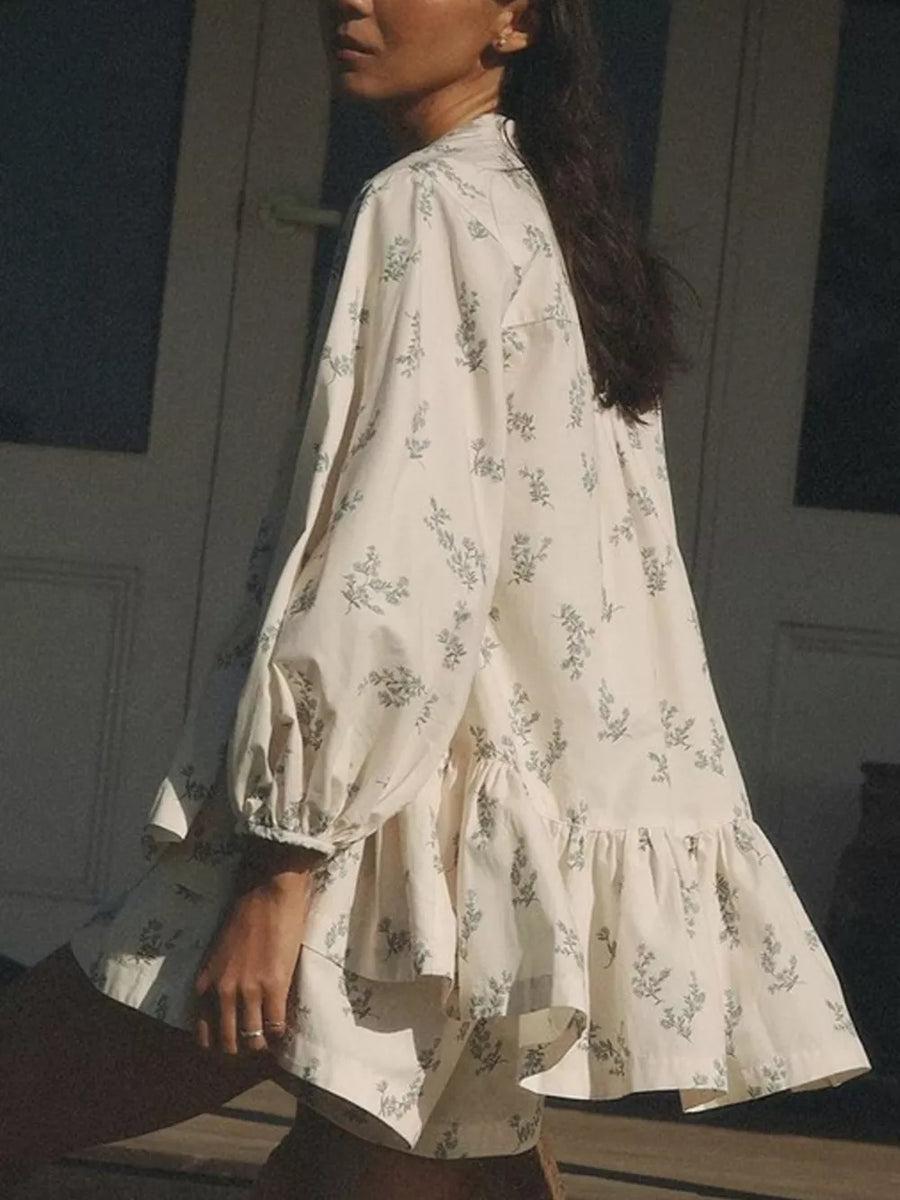 Cream floral print mini dress with ruffled hem and puff sleeves