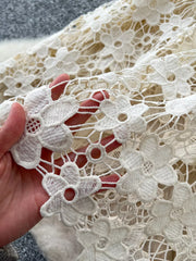 Tiered lace detail skirt in apricot with floral embroidery and elastic waist.