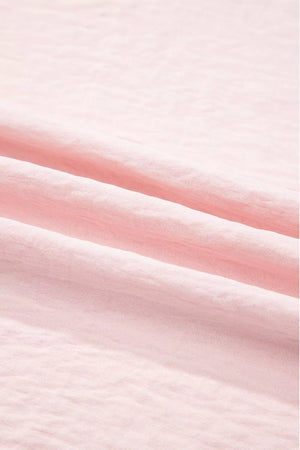 Blush pink polyester blouse with ruffle trim detail