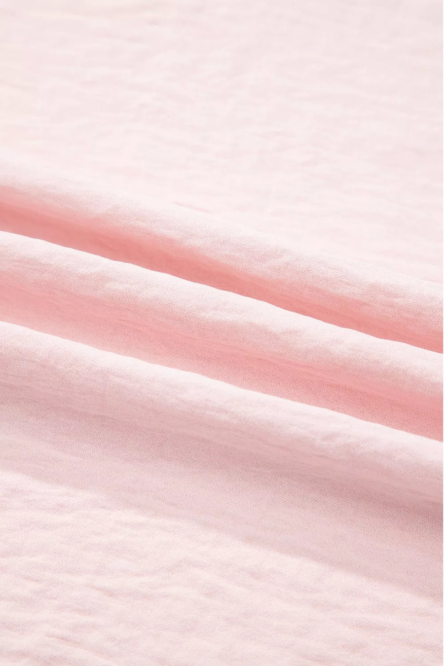 Blush pink polyester blouse with ruffle trim detail