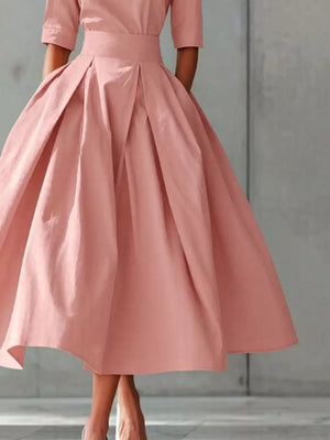 Dusty Pink A-line midi dress with pleated skirt and short sleeves.