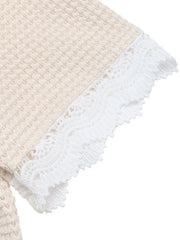 Apricot waffle knit maternity tee with white lace trim detail on sleeve.