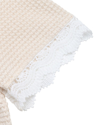 Apricot waffle knit maternity tee with white lace trim detail on sleeve.