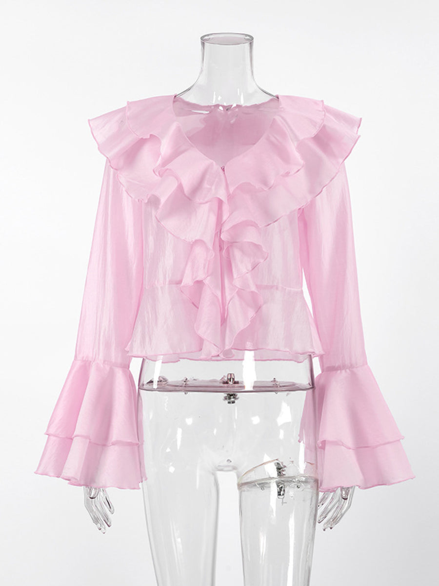 Pink ruffle trim long sleeve blouse with dramatic bell sleeves and ruffled neckline.