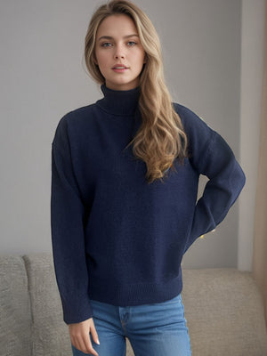 Dark blue relaxed fit turtleneck sweater with ribbed cuffs and hem.