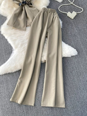 Mocha belted two-piece set with wide-leg pants and pockets.