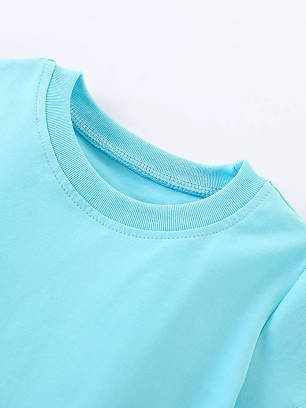 Baby blue cotton crew neck dress with rainbow embroidery detail