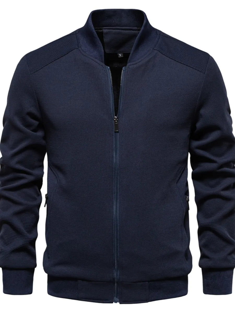 Navy textured knit bomber jacket with zip front and ribbed cuffs.