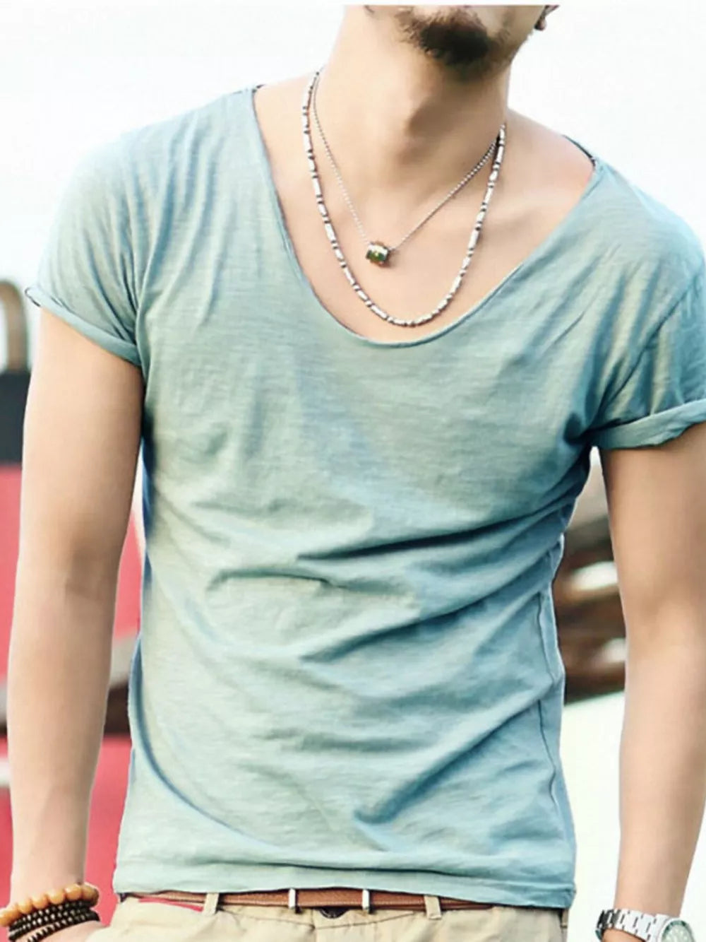 Men's relaxed scoop neck cotton tee in a light blue-green hue, short sleeves, cuffed.