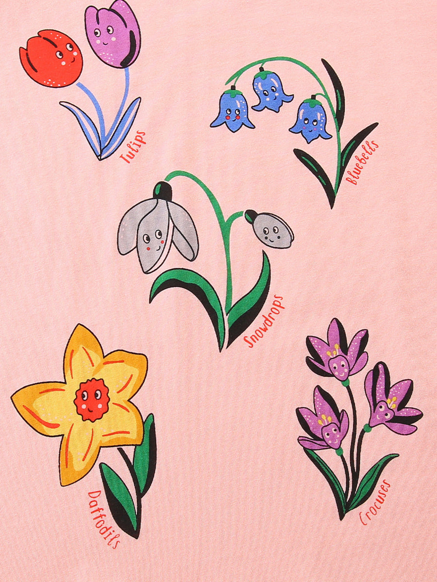 Toddler t-shirt in pink with a whimsical floral print featuring smiling tulips, bluebells, snowdrops, daffodils, and