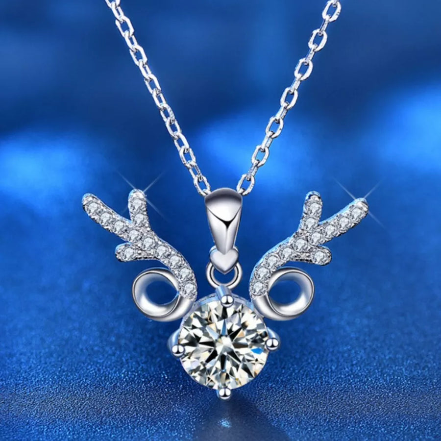 Sterling silver necklace with a moissanite diamond and antler-inspired charm.