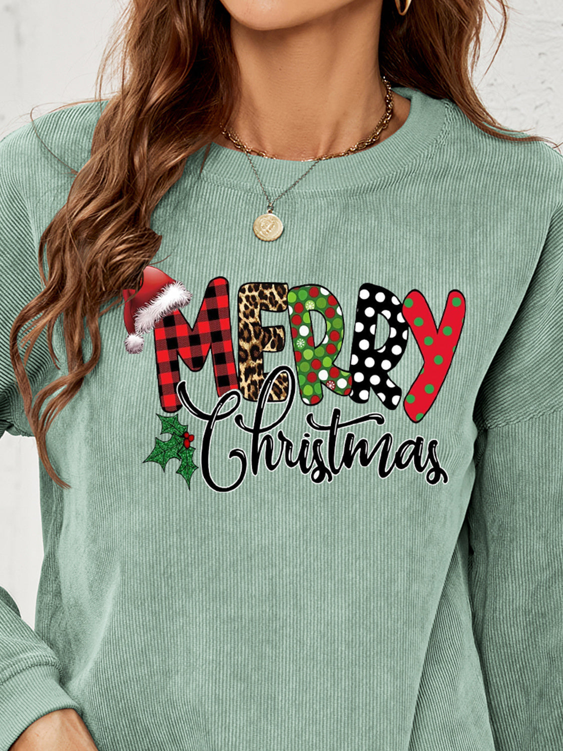 Sage corduroy sweatshirt with Merry Christmas graphic and Santa hat detail