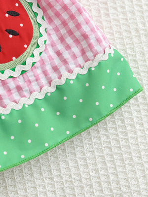 Baby dress with pink gingham, watermelon pocket, green polka dot hem, and white trim.